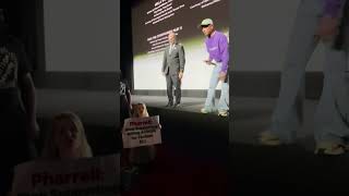 PETA activist crashes Pharrell Williams event yelling at him to stop torturing animals [upl. by Noyes]