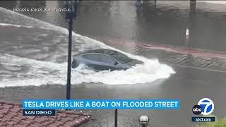 Tesla car plows through flooded San Diego street [upl. by Polly]