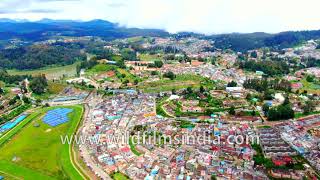 Ooty hill station in Tamil Nadu looks very crowded has many colourful houses in this aerial view [upl. by Adnam]