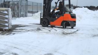 Snow chains on a forklift [upl. by Ymerrej165]