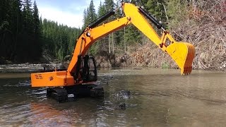 RC ADVENTURES  Piling Rocks in a River with a 4200xl Hydraulic Excavator 112 scale [upl. by Flannery]