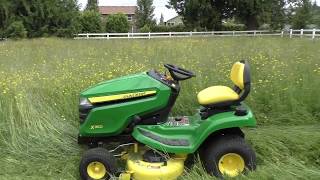 John Deere X350 mowing grass 45 feet tall yes it can do it [upl. by Rratsal764]