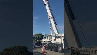 Liebherr LTM 110053 Mobile Crane Lifting and Moving Main Counterweight Onto Flatbed Truck [upl. by Eugenie80]