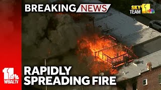 Rapidly spreading fire consumes rowhomes in Baltimore [upl. by Hepsoj]