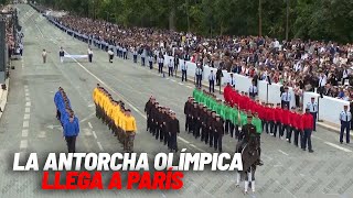 La antorcha olímpica llega a París en el día de la Fiesta Nacional en Francia I MARCA [upl. by Johnson]