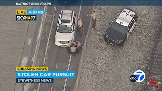 FULL CHASE Carjacking suspect drives over spike strips goes off road onto bike path [upl. by Aihtenak]