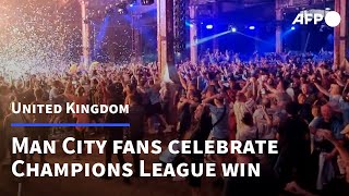 Fans in Manchester go wild as Man City win Champions League  AFP [upl. by Varhol]