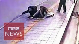 Video Sinkhole in South Korea swallows 2 pedestrians  BBC News [upl. by Ethelstan73]