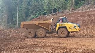 Arthiculated KOMATSU HM4003 tandem D65P in action komatsu arthic mining [upl. by Kcerred]