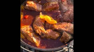 Country style pork ribs on a Dutch oven over a fire [upl. by Nilpik]