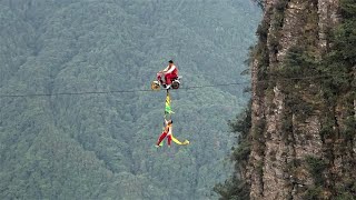 Cycling on a tightrope between cliffs  Dangerous aerial acrobatics  Wonders of China [upl. by Emoraj]