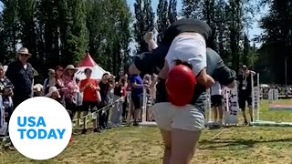 Husbands compete in wifecarrying contest  USA TODAY [upl. by Oeht]