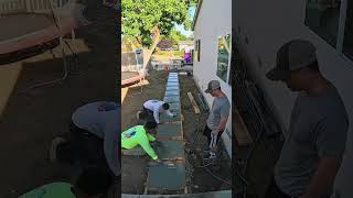 Concrete slab action going in on the front yard from the garage to the front door [upl. by Yblok]