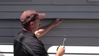 How To Replace One Piece Of Vinyl Siding MidWall [upl. by Eninahs]