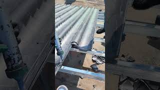 The process of installing roof tiles on a metal frame [upl. by Wernda]