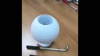 This creative golf ballshaped pen holder is small and unique adding color to your desktop [upl. by Suirred]