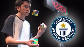 Solving Three Puzzle Cubes WHILST JUGGLING  Guinness World Records [upl. by Cornelia131]