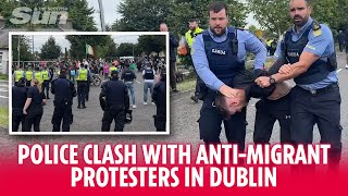 Police clash with antimigrant protesters in Dublin [upl. by Attikin]