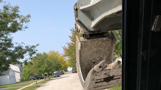 Removing sidewalk with a Gradall [upl. by Derte]