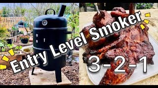 Smoking Ribs How I smoke meat on a budget upright smoker [upl. by Ilanos]