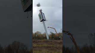 Watch an Advertising Tower Get Demolished by Excavator in Seconds demolition excavator [upl. by Cassius]