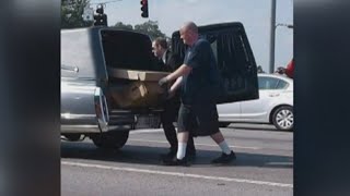 Body in cardboard coffin falls out of hearse [upl. by Bremen]