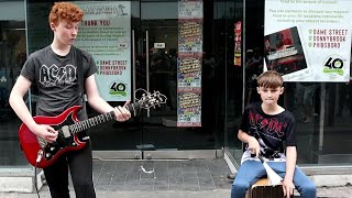 As ACDC Arrive in Dublin For a Concert Brothers Liam amp Adam Curran Perform One of Their Hits [upl. by Huskey]