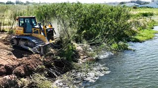 Nice Working Shantui Bulldozer Clearing Grass Into Water [upl. by Abbi]