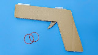 How to make a cardboard gun that shoots rubber band  cardboard gun easy [upl. by Llydnek687]