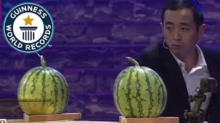 Most playing cards thrown into watermelons in one minute  Guinness World Records [upl. by Eastlake]