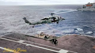 US aircraft carrier conduct a vertival replenishment at sea VERTREP [upl. by Enaujed]