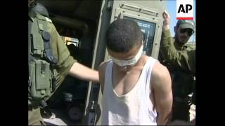 Israeli troops apprehend man wearing explosives belt destroy belt [upl. by Marena]