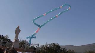 Large rosary balloon released with a prayer above Medjugorje [upl. by Lattonia]