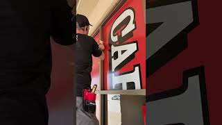 Installing perforated window vinyl with one way vision graphics [upl. by Akelam962]