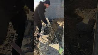 Completing a Blue Stone retaining wall canberra stonemason masonry landscaping [upl. by Erbes]