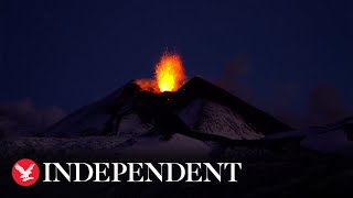 Stunning footage shows Mount Etna volcano eruption inside snowcapped crater [upl. by Mutz]