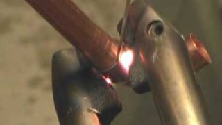 Resistance brazing 38 and 12quot copper tubing using American Beauty resistance soldering equipment [upl. by Atteram267]