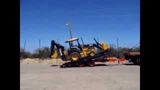 Loading a backhoe to trailer without ramps [upl. by Masao]