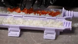 Chef spreading rice on nori sheet using sushi machine [upl. by Ramunni348]