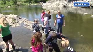 Students help stock trout [upl. by Wanfried]