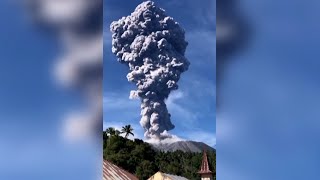 WATCH  Massive column of ash smoke hovers over erupted volcano in Indonesia [upl. by Harolda]