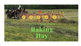 Raking hay with a New Holland wheel rake [upl. by Stig]