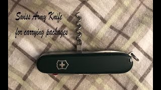 Using a Swiss Army Knifes corkscrew as a secure carrying handle [upl. by Konrad]