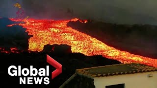 La Palma volcano Lava quottsunamiquot gushes down hillside after overflowing main cone [upl. by Asseneg]