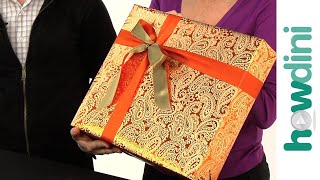 How to tie a ribbon onto a gift box [upl. by Enirehtakyram671]