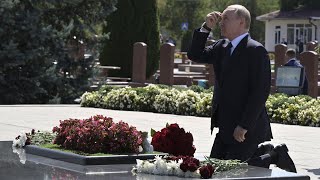 Russias Putin kneels down at memorial to victims of 2004 deadly Beslan siege [upl. by Ardnasak397]