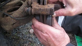 Replacing rear brake pads and lubricating caliper slide pins on a vehicle with disk brakes [upl. by Hersh]