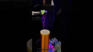 Tesla coil exiting mediums my finger neon gas ion glass and a scintillator crystal shorts [upl. by Anahahs]