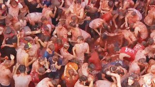 Food Fight 20000 People Toss Tomatoes at Spains La Tomatina [upl. by Edla]