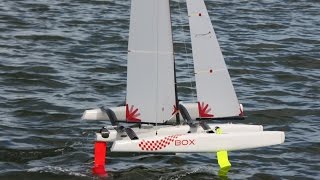 Foiling  radio controlled One Metre trimarans with Z and kinked foils [upl. by Bardo]